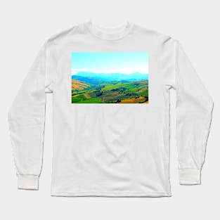 Scenery in Carassai with rolling fields and hazy mountains in the background Long Sleeve T-Shirt